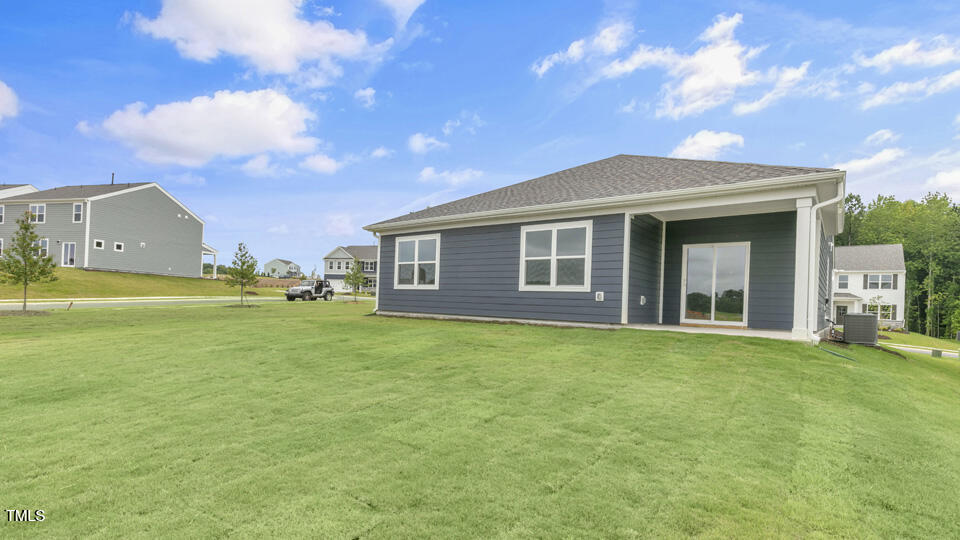 905 Comice Pear Way Willow Spring, NC 27592 - Photo 31 of 33 a front view of a house with garden