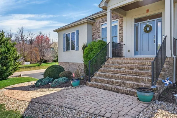 a view of a house with backyard and garden