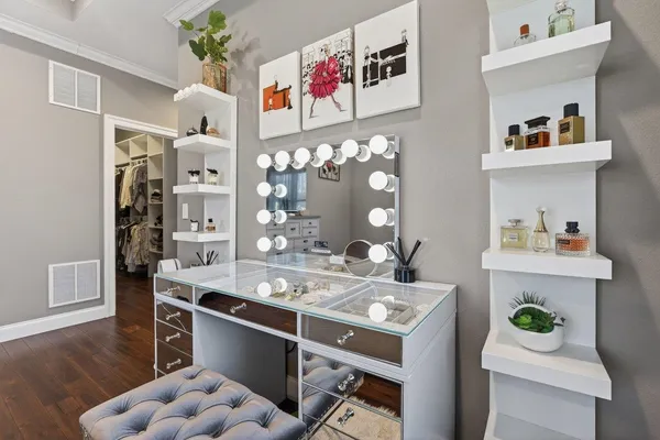 a spacious bedroom with a bed and a cabinets