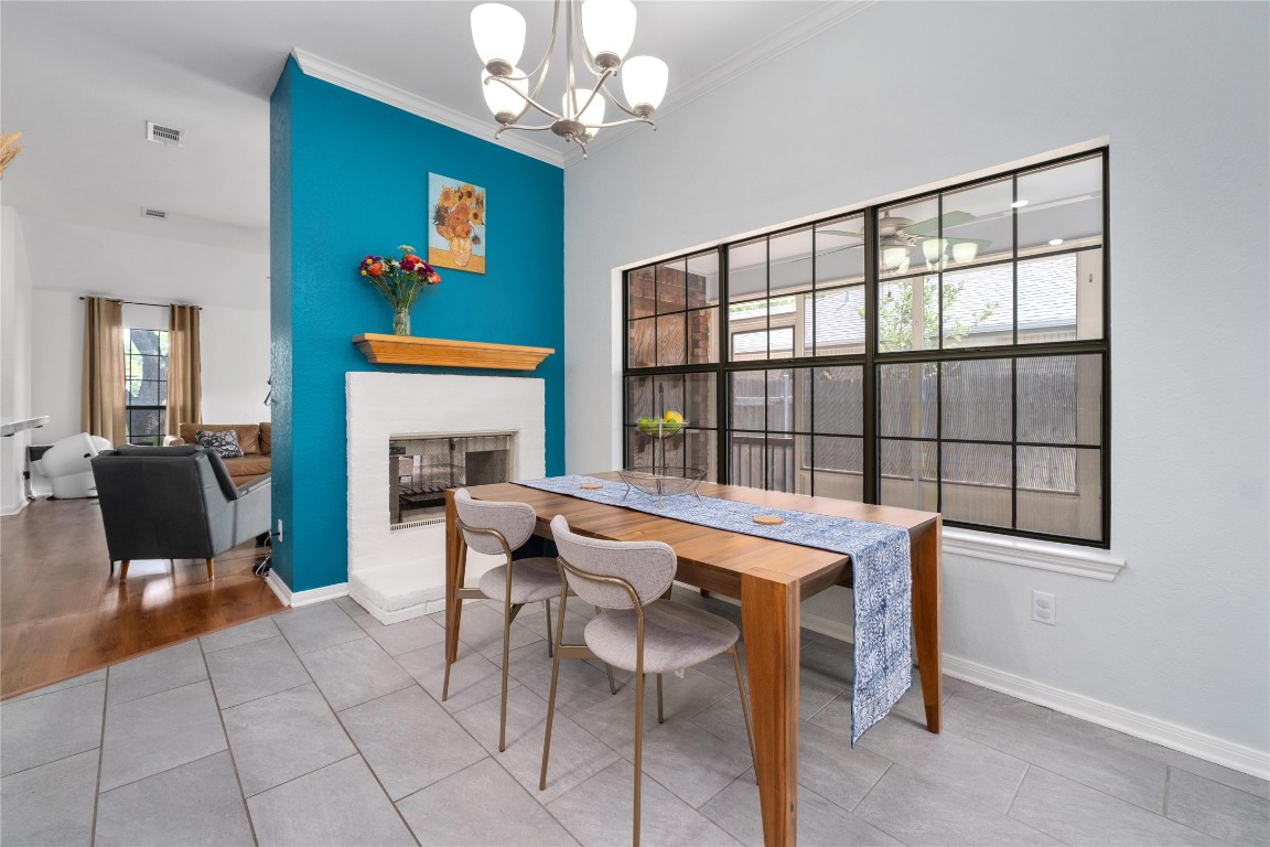 2317 Sycamore Trail Round Rock, TX 78664 - Photo 12 of 31 a view of a dining room with furniture a chandelier and window