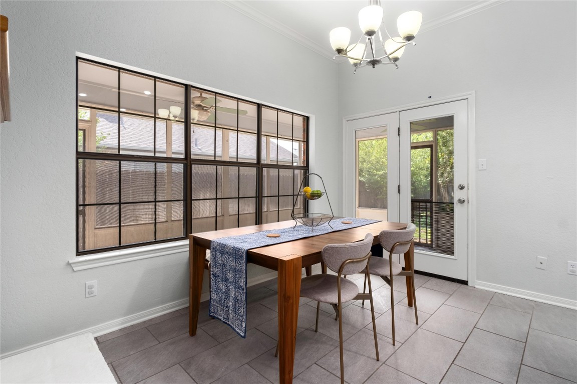 2317 Sycamore Trail Round Rock, TX 78664 - Photo 13 of 31 a view of a dining room with furniture a chandelier and window