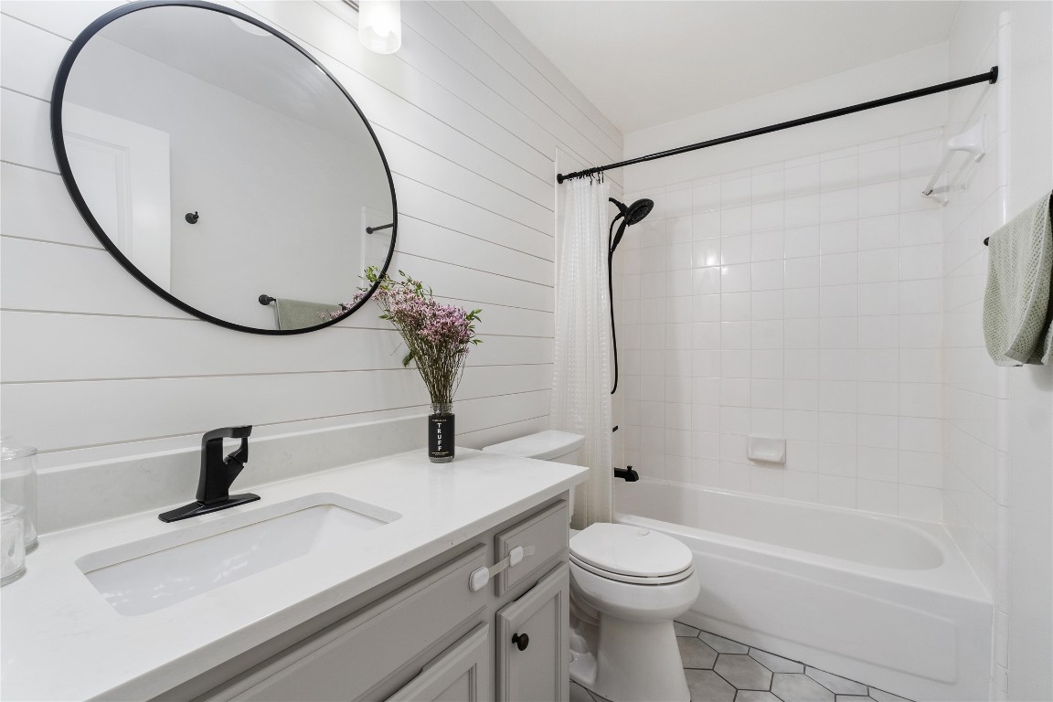 2317 Sycamore Trail Round Rock, TX 78664 - Photo 22 of 31 a bathroom with a sink a toilet and a mirror