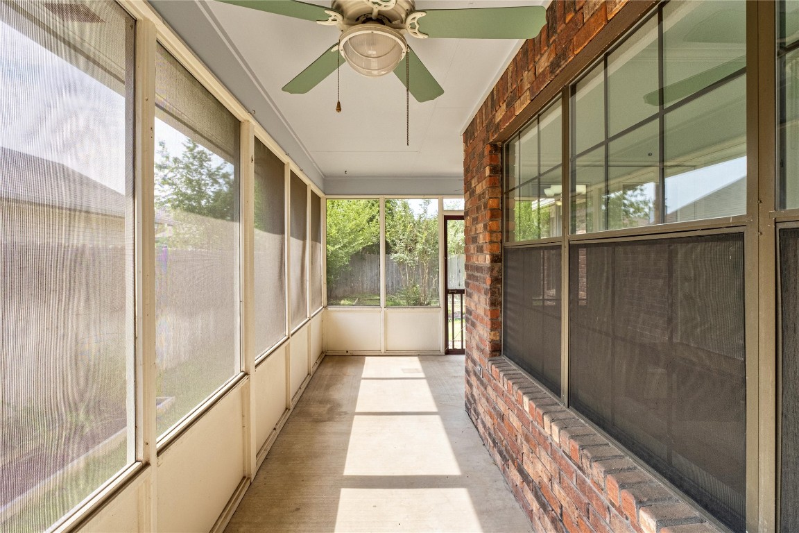 2317 Sycamore Trail Round Rock, TX 78664 - Photo 30 of 31 a hallway with a large dining chandelier and glass door