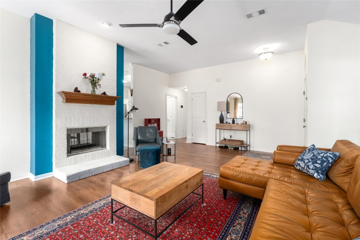 2317 Sycamore Trail Round Rock, TX 78664 - Photo 8 of 31 a living room with furniture and a fireplace