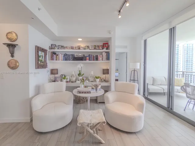 a living room with furniture and view of living room