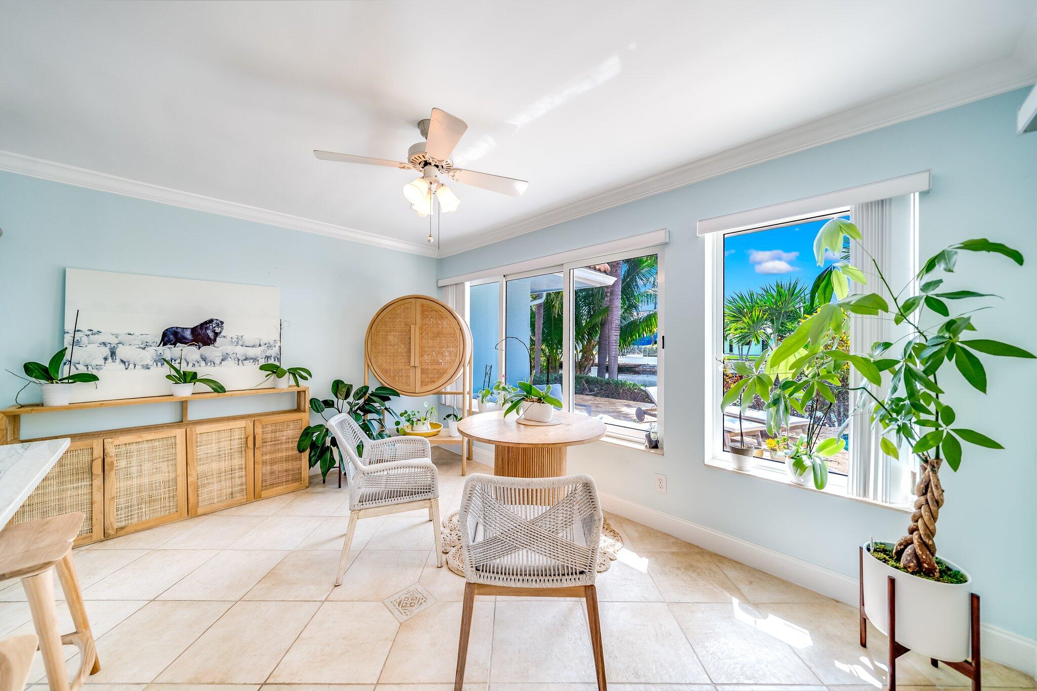 4010 Northeast 25th Avenue Lighthouse Point, FL 33064 - Photo 27 of 57 a living room with furniture a potted plant and a large window