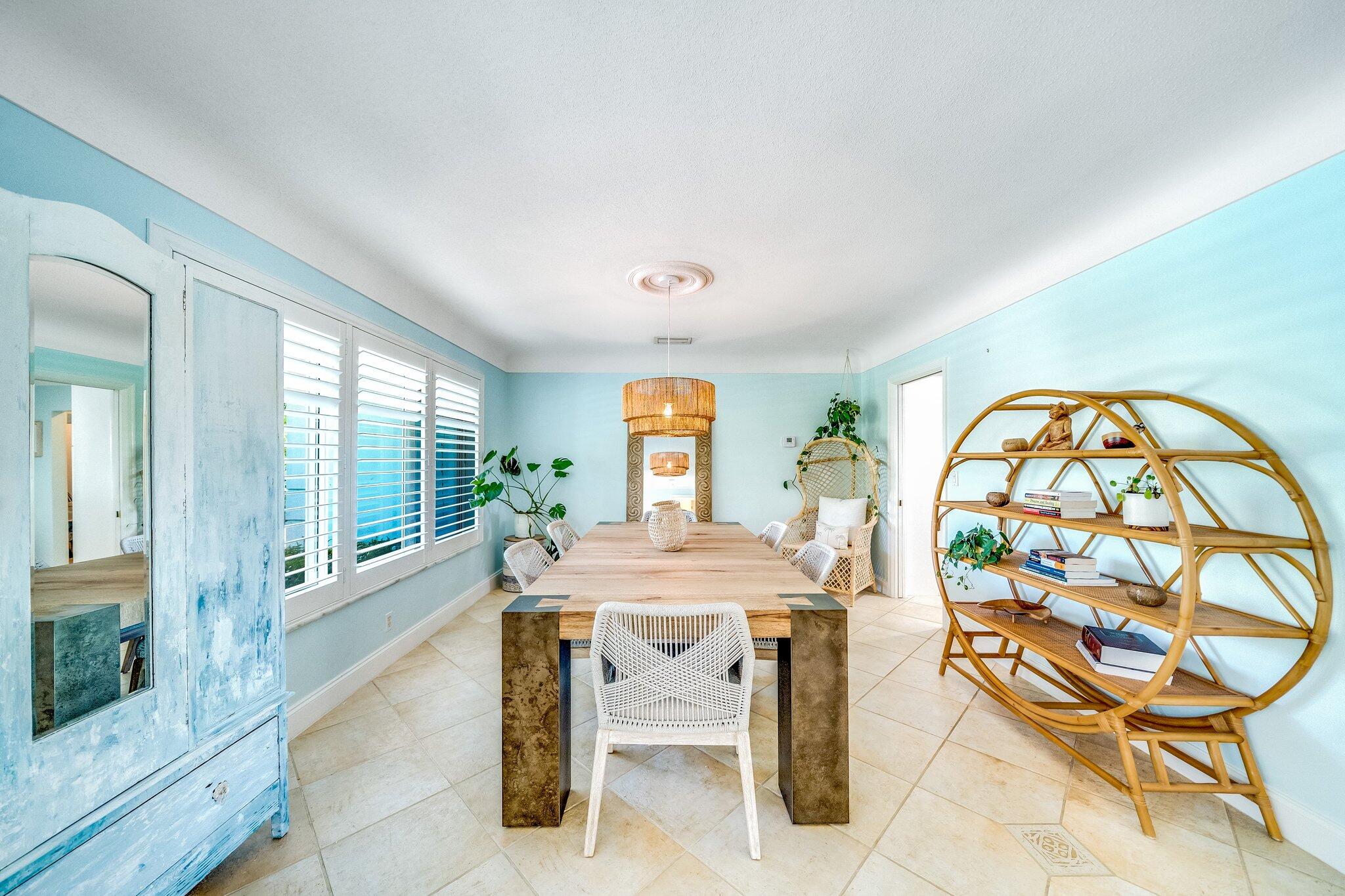 4010 Northeast 25th Avenue Lighthouse Point, FL 33064 - Photo 10 of 57 a view of a dining room with furniture large windows and wooden floor