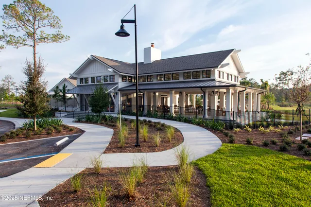 a kitchen with a dining table and chairs
