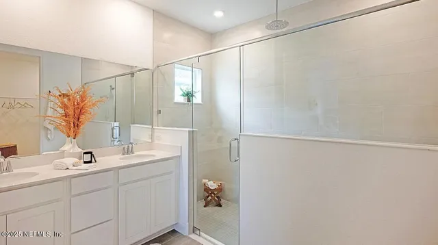 a bedroom with a bed and paintings on the wall