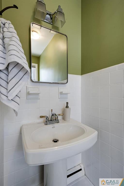 5 Sequola Road Hamilton, NJ 08619 - Photo 14 of 17 a bathroom with a sink and a mirror