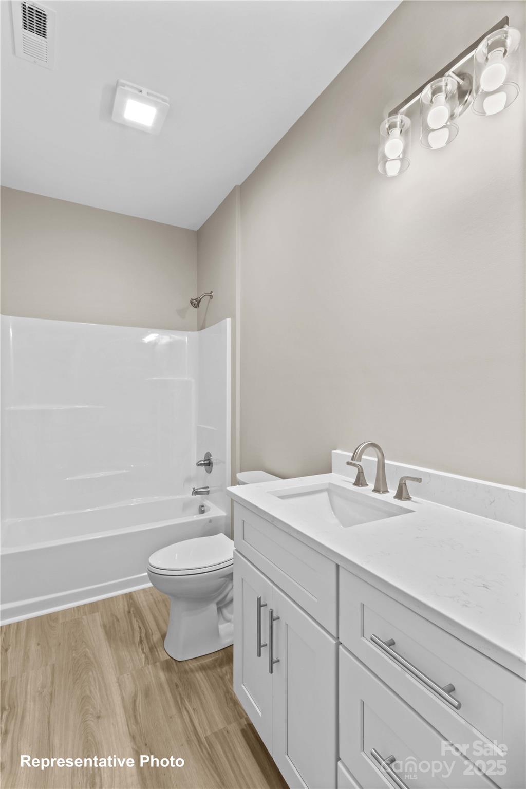 986 Tabor Road Olin, NC 28660 - Photo 21 of 27 a bathroom with a sink a toilet and shower