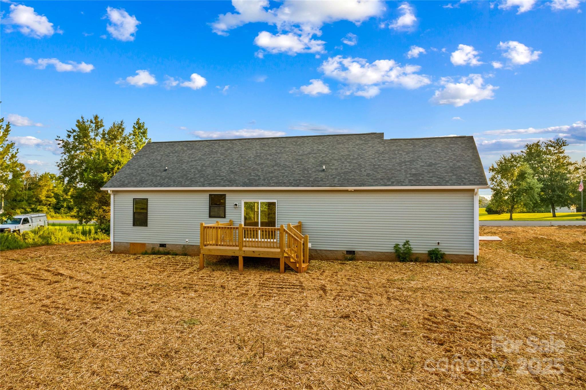986 Tabor Road Olin, NC 28660 - Photo 25 of 27 a view of a house with backyard and sitting area