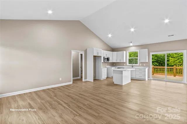 a view of a kitchen with wooden floor