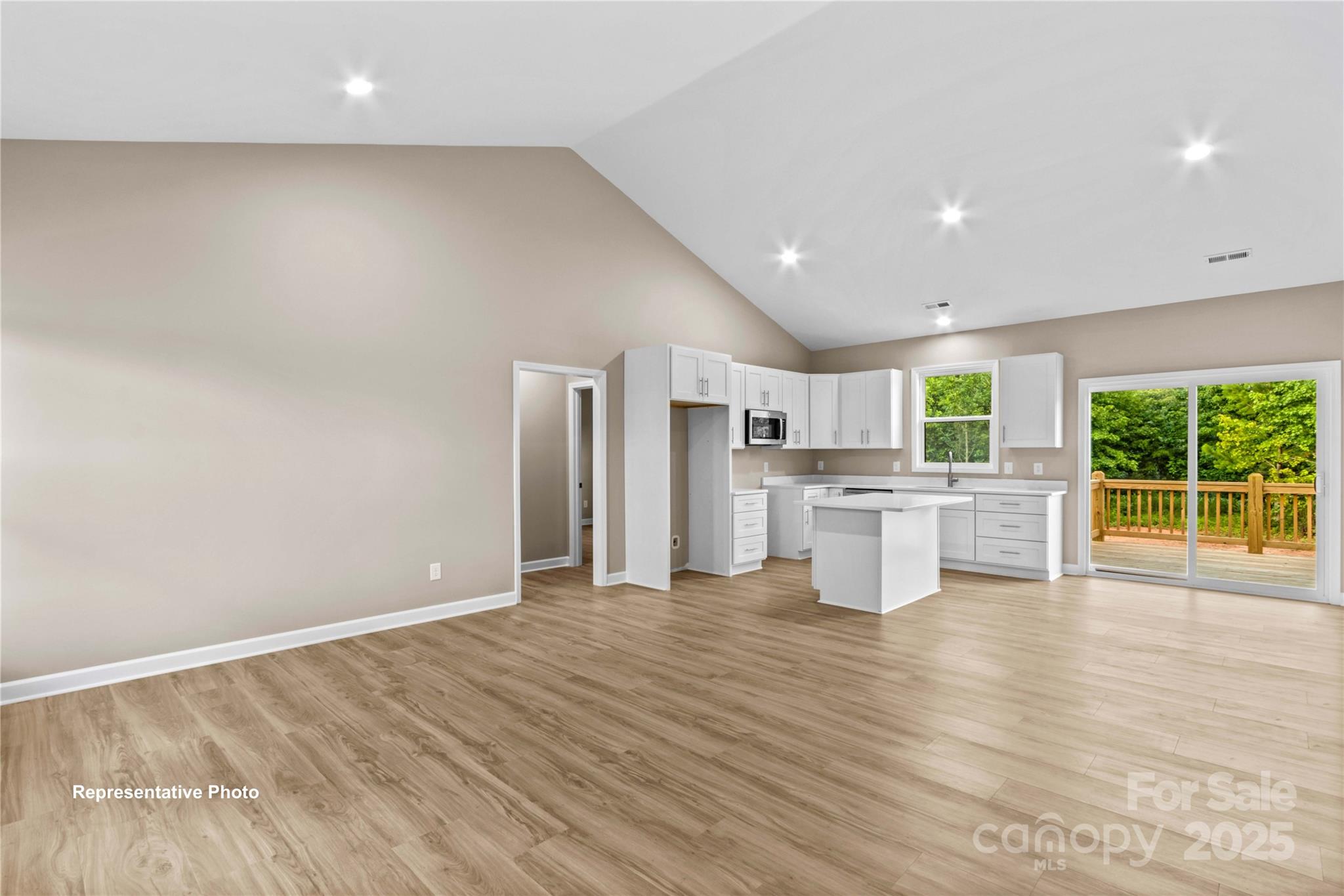 986 Tabor Road Olin, NC 28660 - Photo 4 of 27 a view of a kitchen with wooden floor