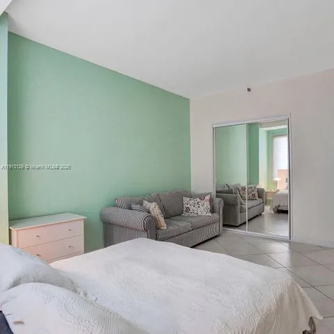 a bedroom with a bed and furniture