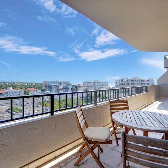 151 Crandon Boulevard, Unit 1130 Key Biscayne, FL 33149 - Photo 31 of 39 a view of a balcony with an outdoor seating