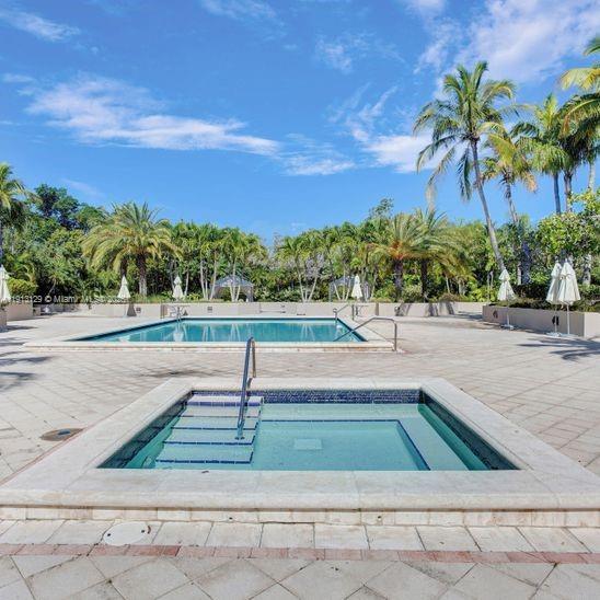 151 Crandon Boulevard, Unit 1130 Key Biscayne, FL 33149 - Photo 32 of 39 a view of swimming pool with a yard