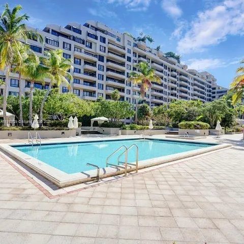 a view of a swimming pool with a lounge chairs