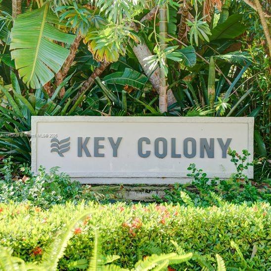 151 Crandon Boulevard, Unit 1130 Key Biscayne, FL 33149 - Photo 39 of 39 a sign broad in front of flowers