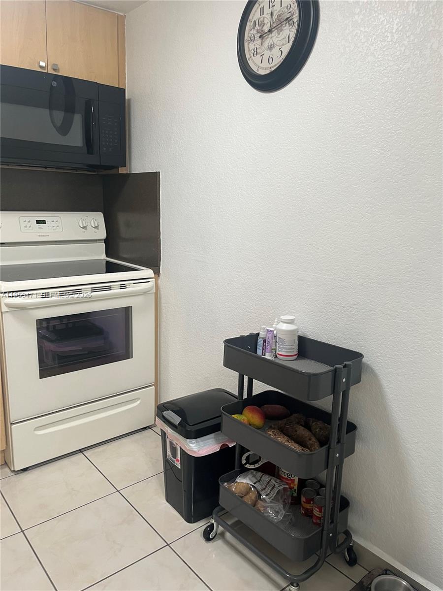 606 West 81st Street, Unit 210 Hialeah, FL 33014 - Photo 9 of 19 a view of washer and dryer