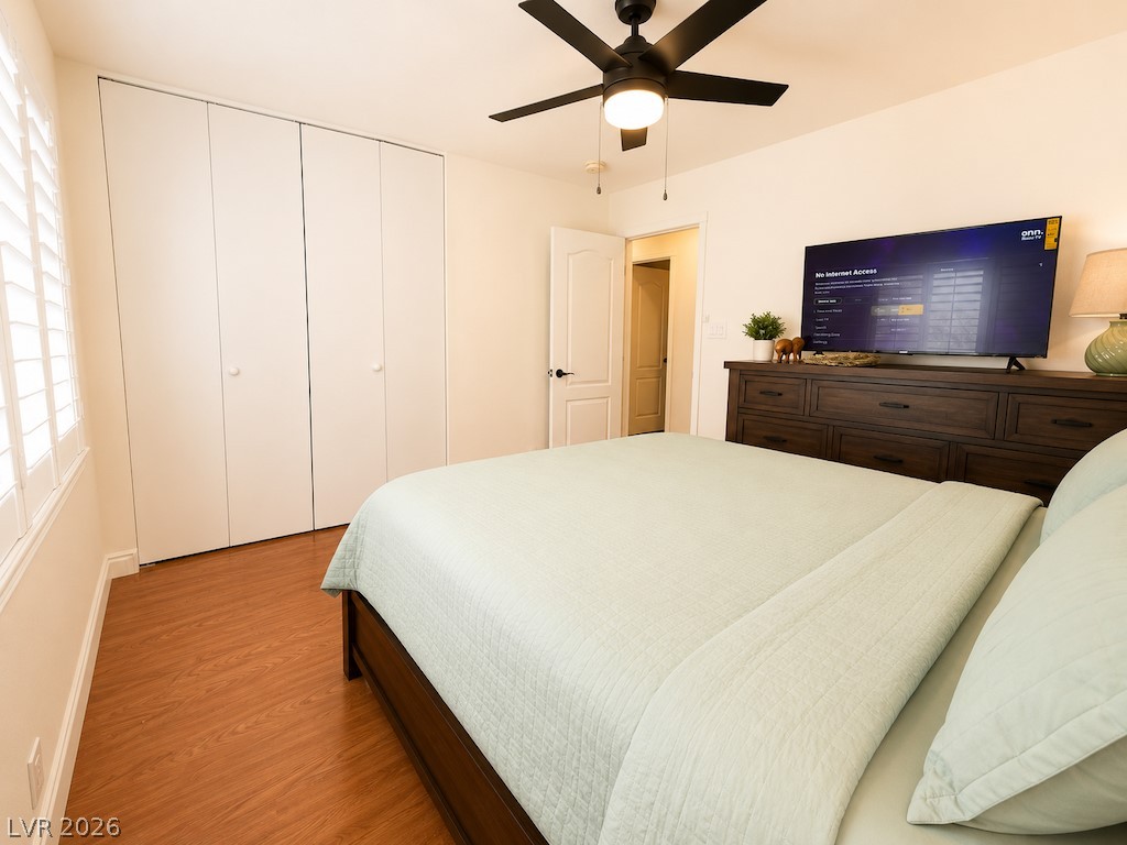 3010 East Viking Road Las Vegas, NV 89121 - Photo 22 of 48 Relax in this tranquil bedroom, featuring sleek wood flooring and ample closet space.