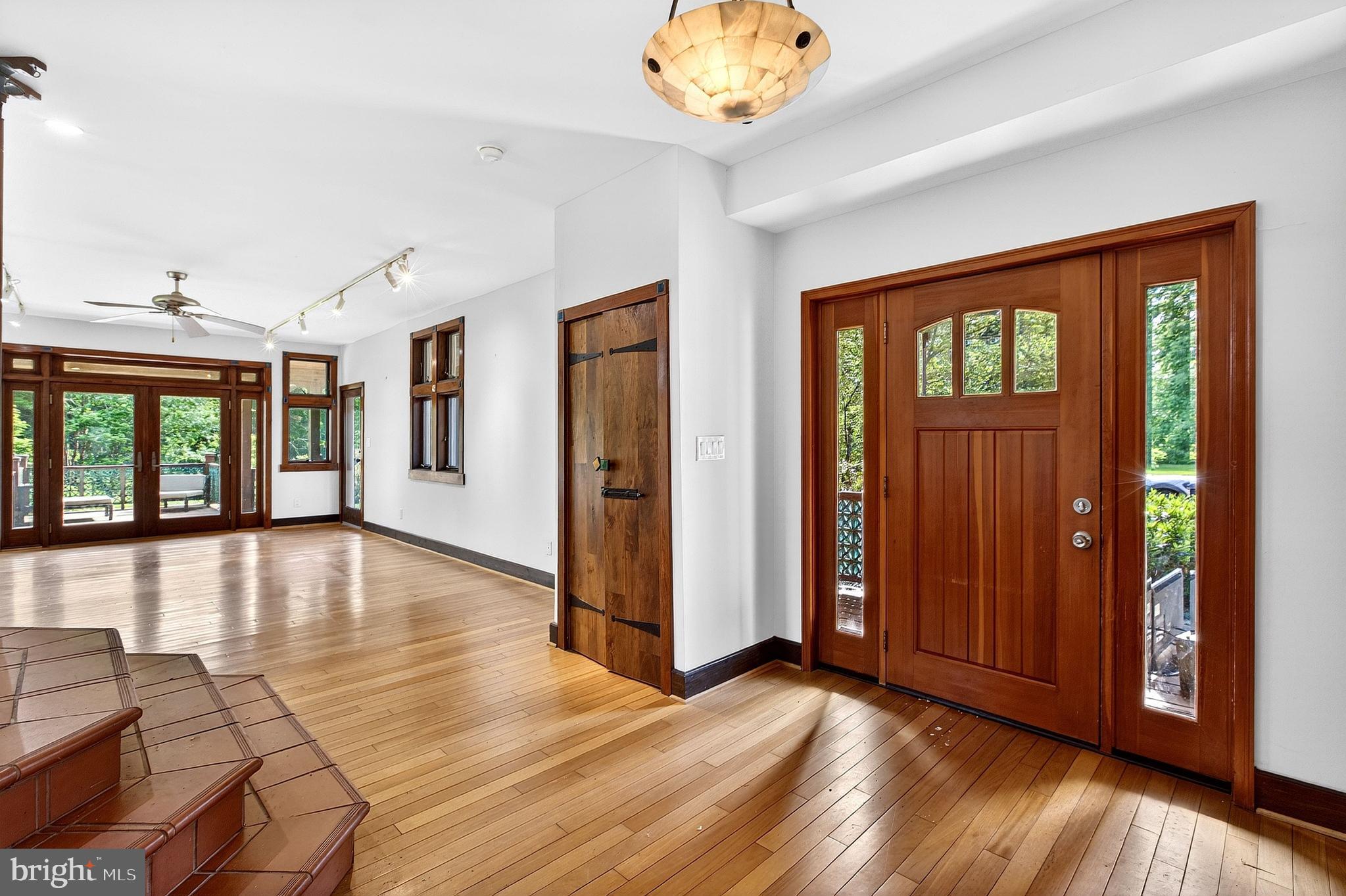 498 Perrineville Road Robbinsville, NJ 08691 - Photo 23 of 59 wooden floor in an empty room with a window