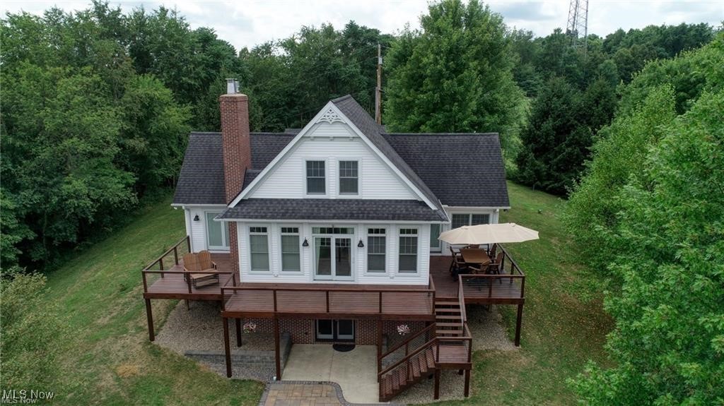 66333 Read Road Cambridge, OH 43725 - Photo 3 of 49 Back of house with a patio area, a lawn, and a deck