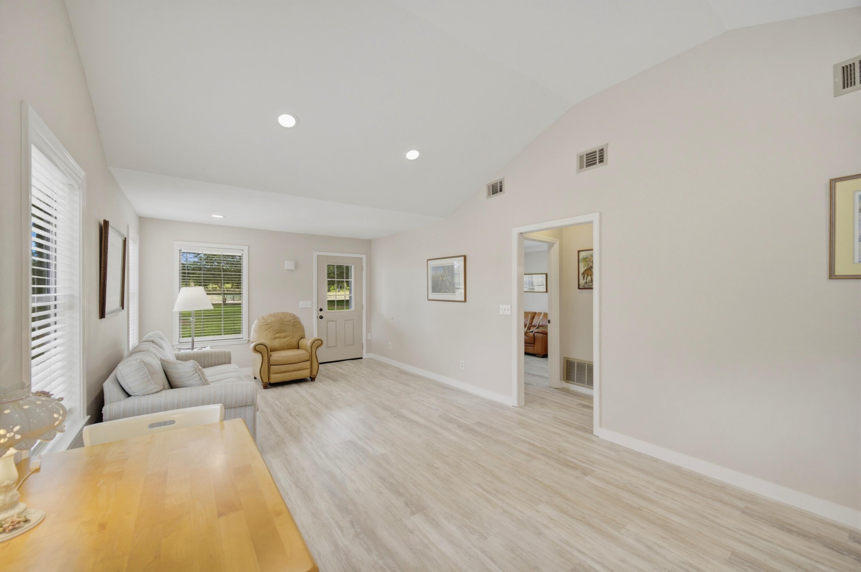 261 Wilkerson Road DeFuniak Springs, FL 32433 - Photo 57 of 76 a view of a livingroom with furniture wooden floor and windows