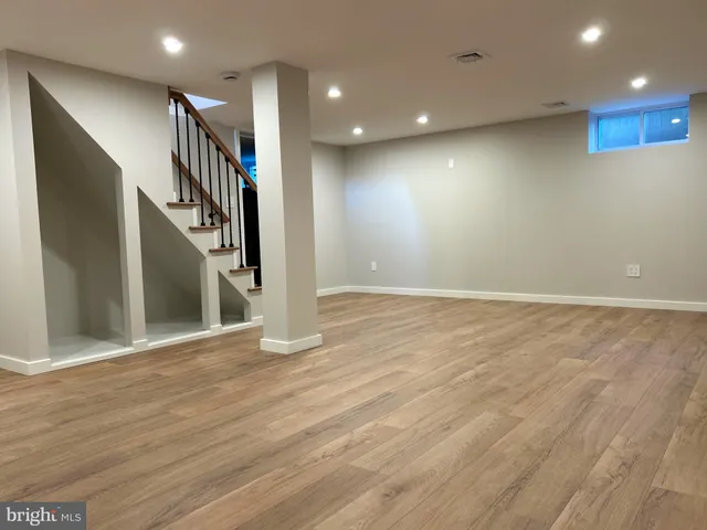 a view of an empty room with stairs