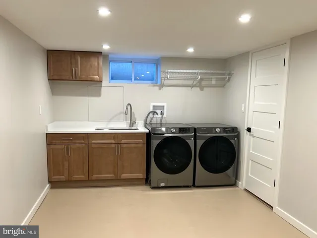 a kitchen with a stove a microwave and cabinets