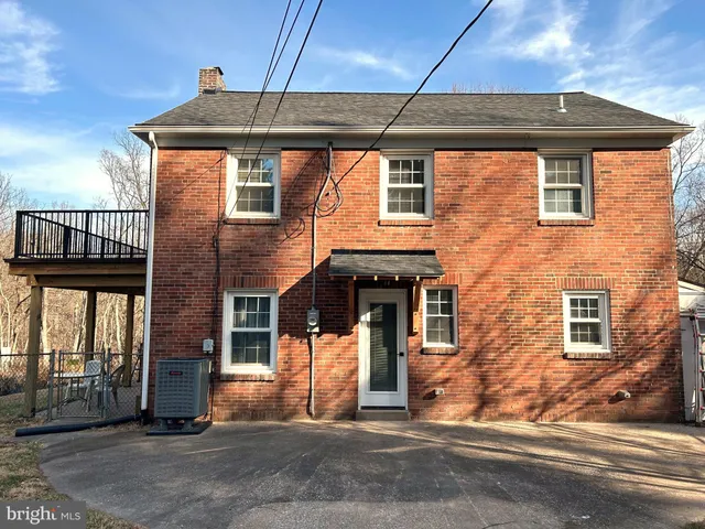 a front view of a house with a garage
