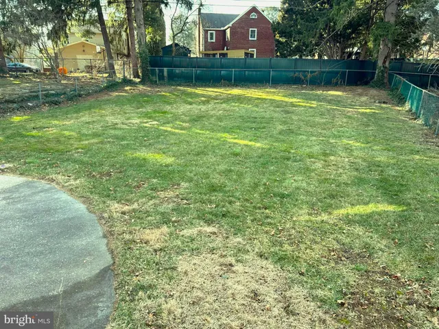a swimming pool with outdoor seating and yard