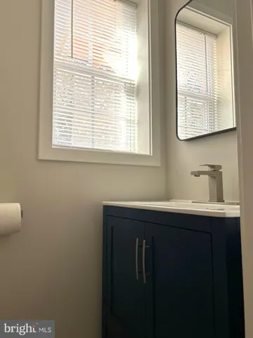a view of a bathroom with a sink and a window
