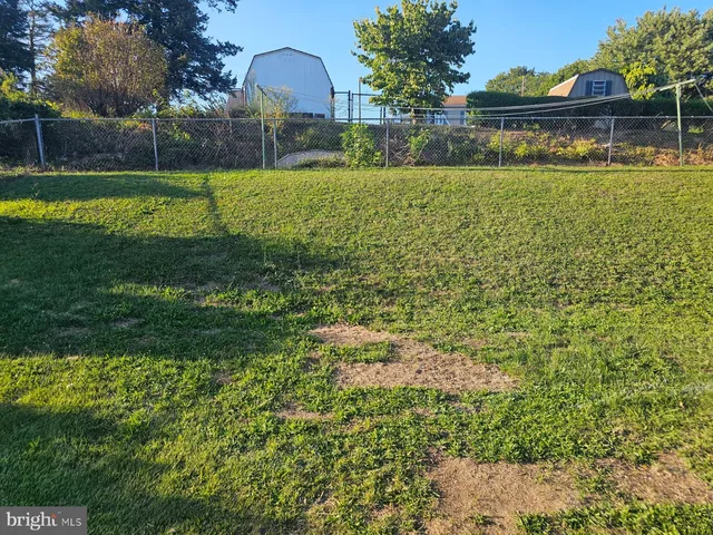 a view of a lake with a house in the background