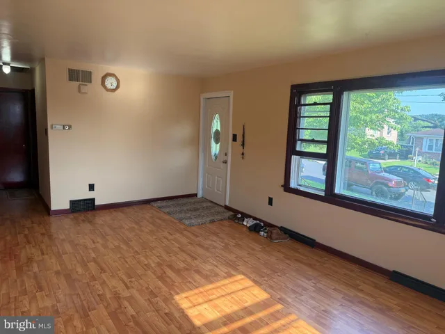 a view of a room with a large window