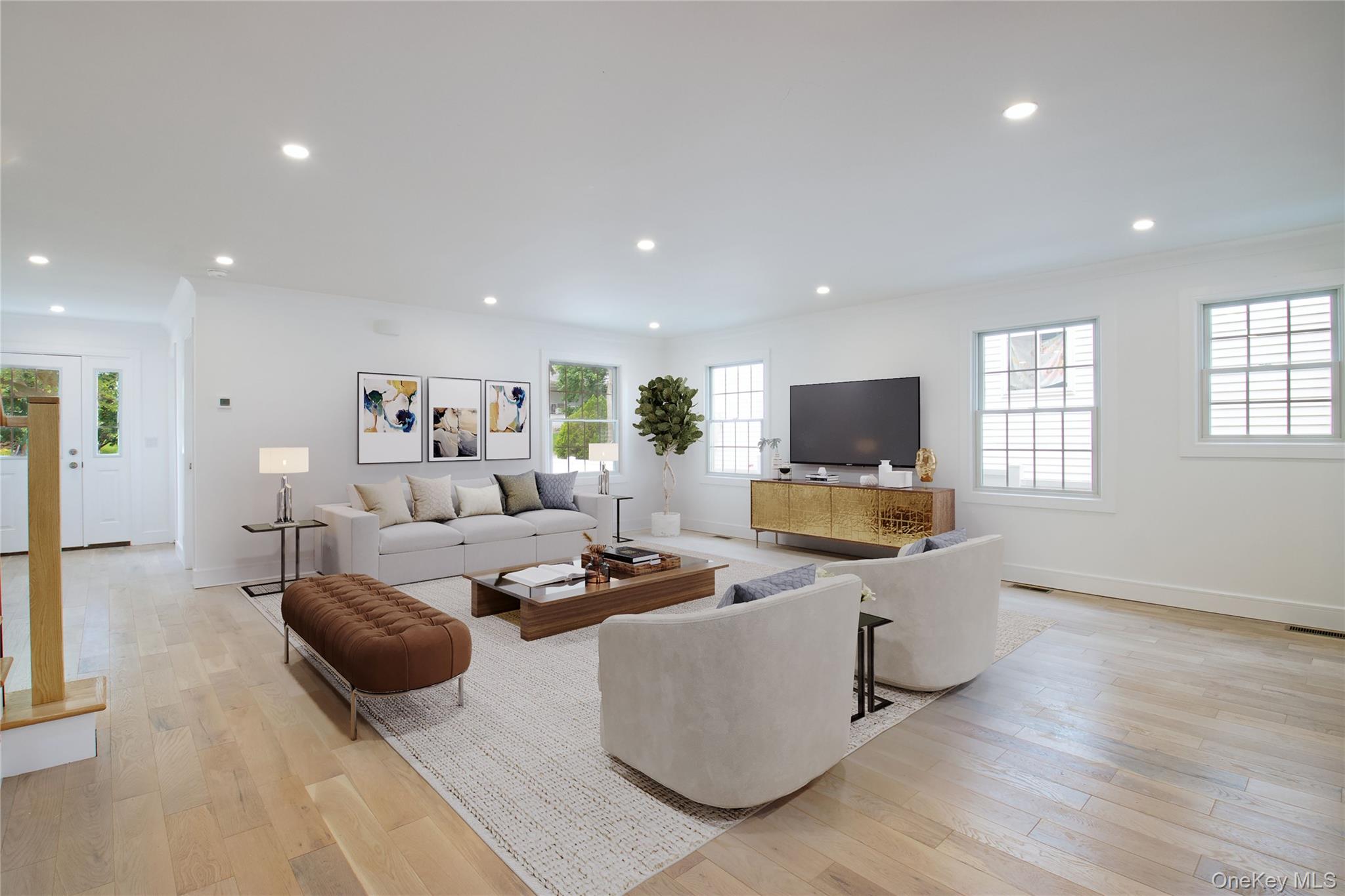 30 Kirkwood Road, Unit B Port Washington, NY 11050 - Photo 8 of 36 a living room with furniture and a flat screen tv