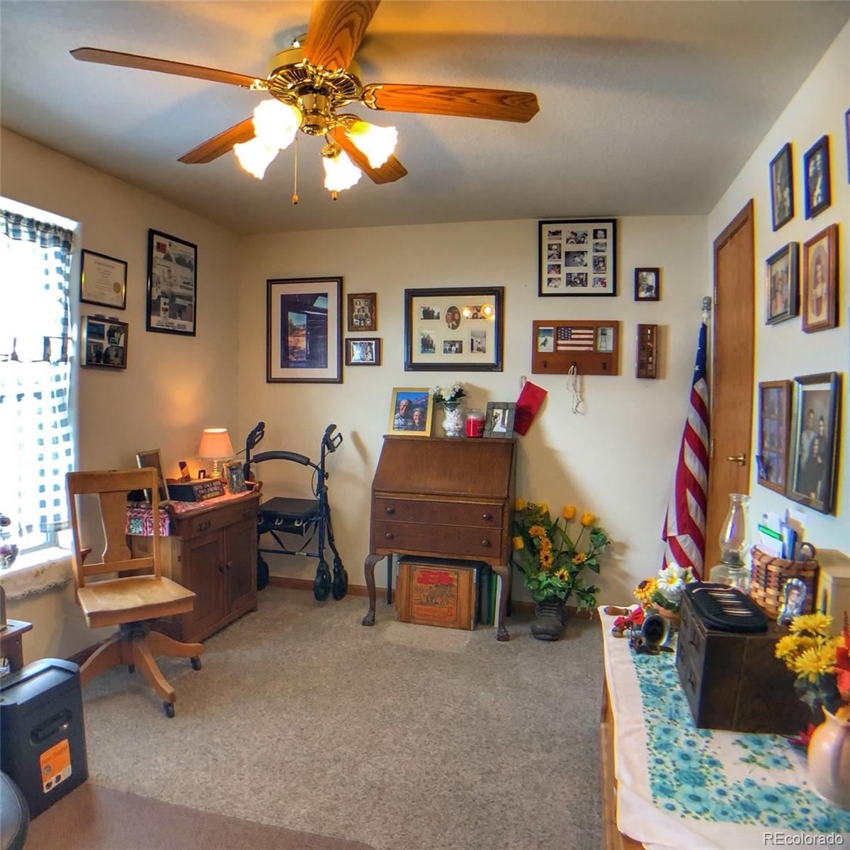 1600 Commanche Road Westcliffe, CO 81252 - Photo 12 of 31 a living room with furniture and a flat screen tv