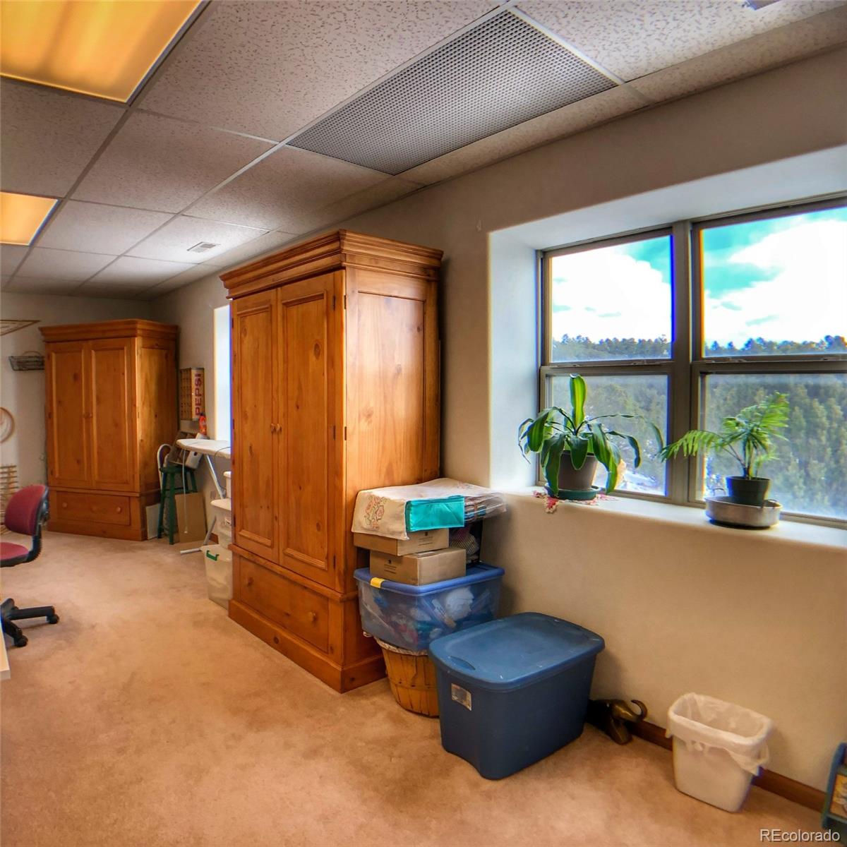 1600 Commanche Road Westcliffe, CO 81252 - Photo 27 of 31 a living room with furniture and a large window