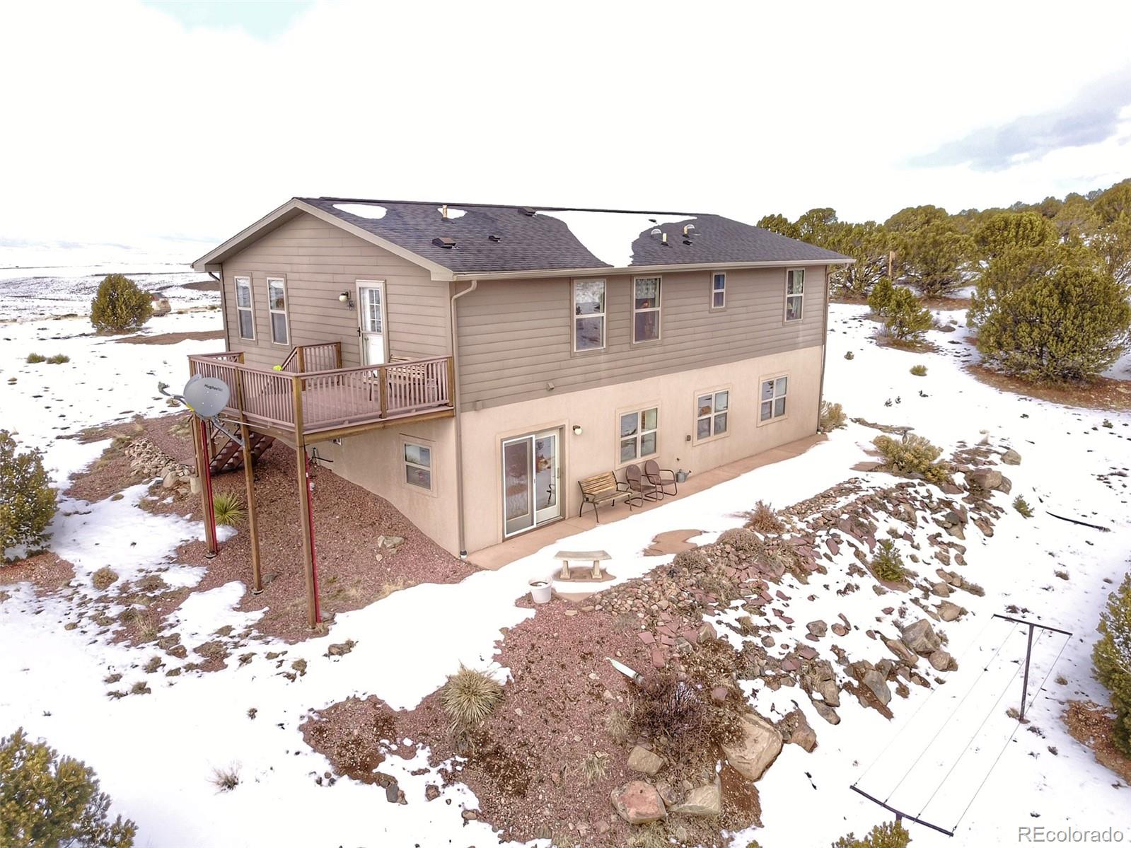 1600 Commanche Road Westcliffe, CO 81252 - Photo 3 of 31 a view of a house with a snow on the road