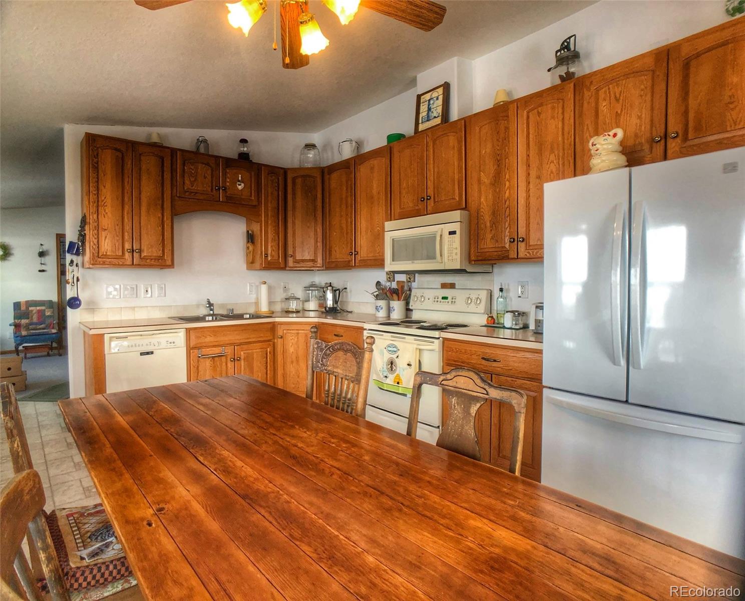 1600 Commanche Road Westcliffe, CO 81252 - Photo 5 of 31 a kitchen with stainless steel appliances granite countertop a refrigerator sink and cabinets