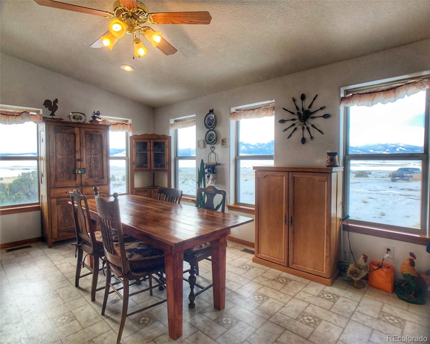 1600 Commanche Road Westcliffe, CO 81252 - Photo 8 of 31 a view of a dining room with furniture window and outside view
