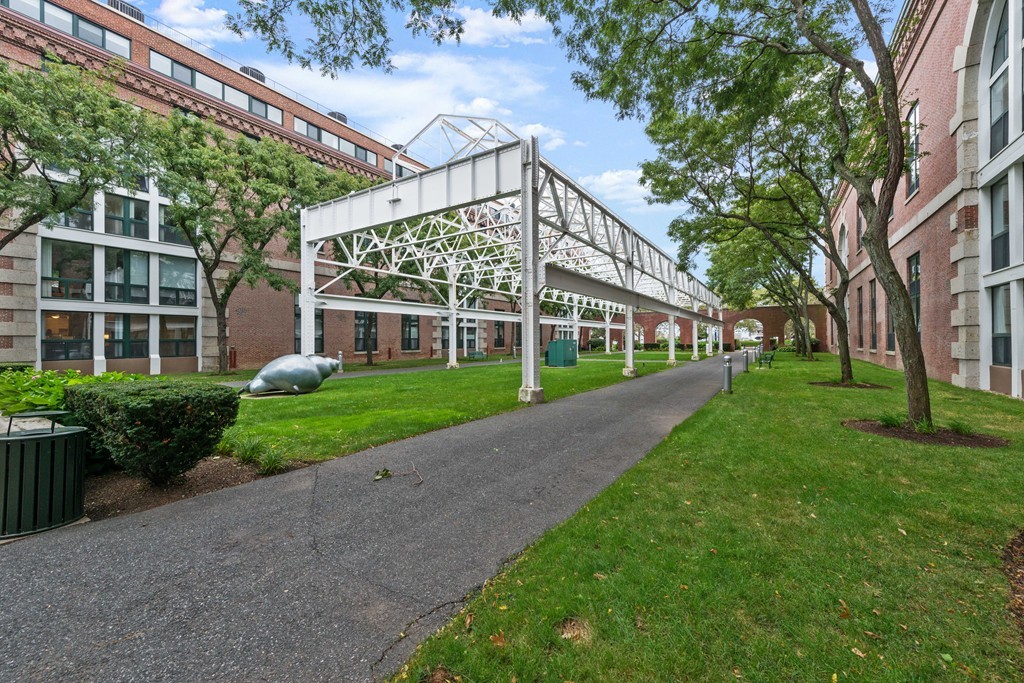 42 8th Street, Unit 5109 Boston, MA 02129 - Photo 16 of 17 a view of a house next to a big yard and large trees