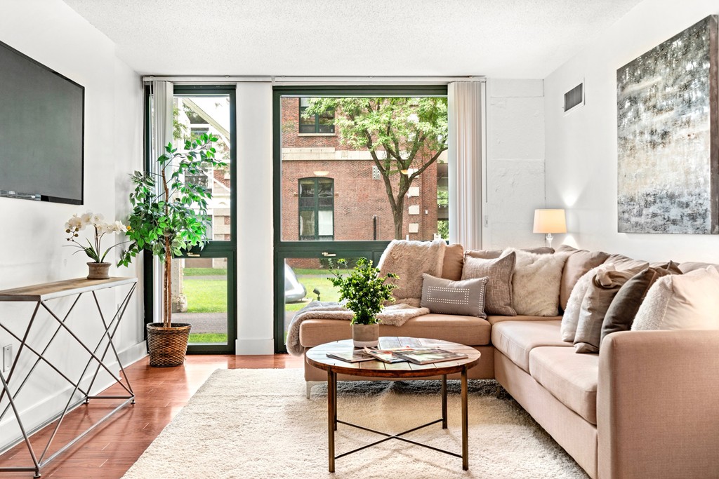 42 8th Street, Unit 5109 Boston, MA 02129 - Photo 3 of 17 a living room with furniture and a large window