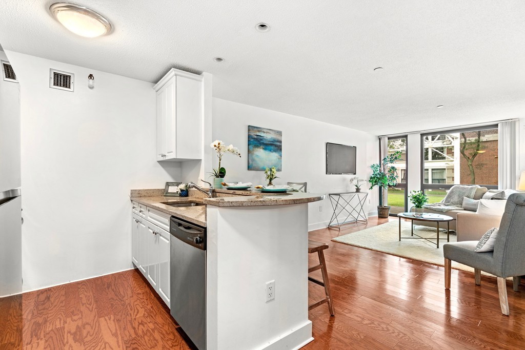 42 8th Street, Unit 5109 Boston, MA 02129 - Photo 6 of 17 a kitchen with stainless steel appliances granite countertop a stove and cabinets