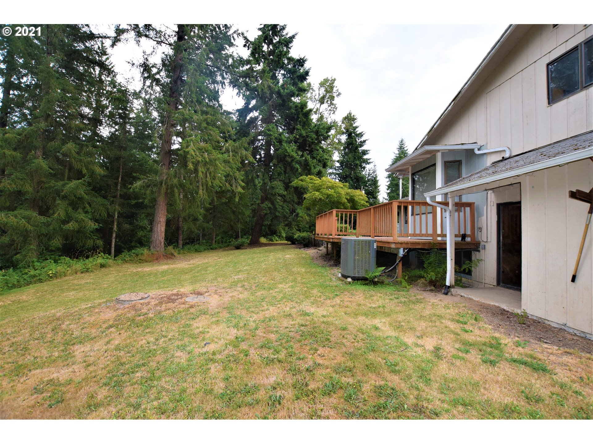 22996 South Central Point Road Canby, OR 97013 - Photo 22 of 32 a view of a house with a yard and sitting area