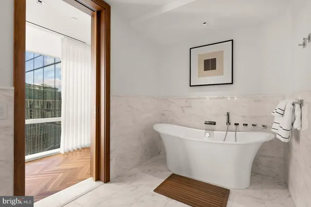 a white bath tub sitting in a bathroom