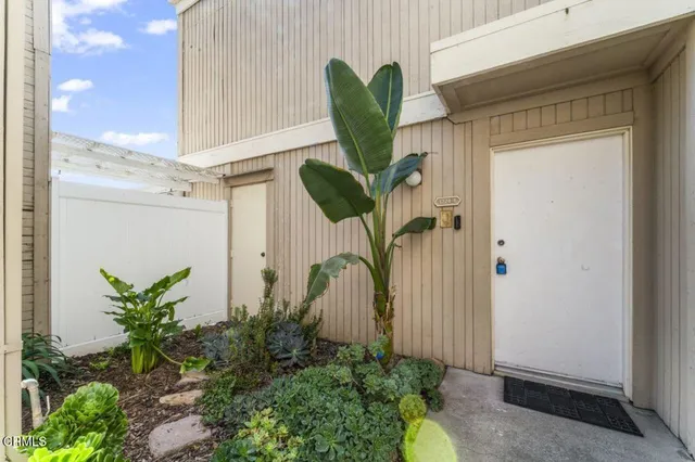 a front view of a house with a yard and a garage