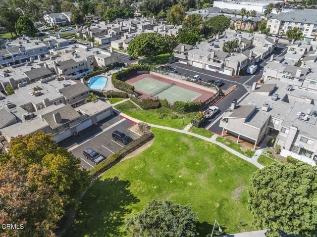 an aerial view of a house with outdoor space