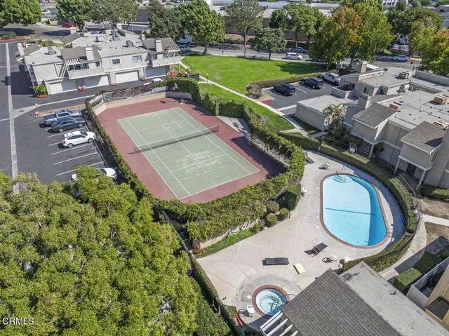 an aerial view of a house with a yard