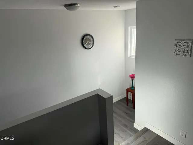a kitchen with white cabinets stainless steel appliances and sink